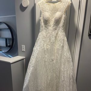 Ivory wedding gown, Size 6. Lace and beading w/open back.